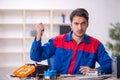 Young male repairman repairing computer Royalty Free Stock Photo