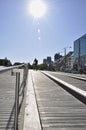 Young male riding bicycle on the boardwalk in waterfront Royalty Free Stock Photo