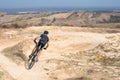 Young male riding a bicycle on the rugged terrain Royalty Free Stock Photo