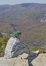 Young male on rocky mountain peak Royalty Free Stock Photo