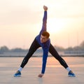 Young Male Runner Stretching Before Run at Sunset. Healthy Lifestyle and Sport Concept. Royalty Free Stock Photo