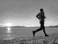 Young male runner training outdoors in winter times, man run