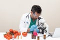 Young male scientist doing experimentation on vegetables in the laboratory Royalty Free Stock Photo