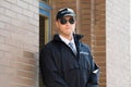 Male Security Guard Standing At The Entrance Royalty Free Stock Photo