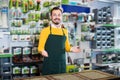 Young male seller demonstrating assortment