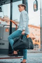 Young male Spanish carrying a bag while riding up a bus Royalty Free Stock Photo