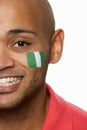 Young Male Sports Fan With Nigerian Flag