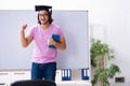 Young male student graduate wearing mortarboard