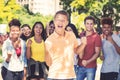 Young male student with group of cheering young adults Royalty Free Stock Photo