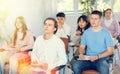 Young male student listening attentively to lecture in lecture hall Royalty Free Stock Photo