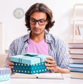 Young male student preparing for exams during Christmas Royalty Free Stock Photo