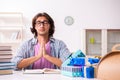 Young male student preparing for exams during Christmas Royalty Free Stock Photo