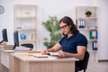 Young male student preparing for exams in the classroom Royalty Free Stock Photo