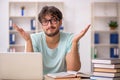 Young male student preparing for exams in the classroom Royalty Free Stock Photo