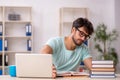 Young male student preparing for exams in the classroom Royalty Free Stock Photo