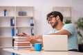 Young male student preparing for exams in the classroom Royalty Free Stock Photo