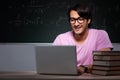 The young male student sitting in classroom Royalty Free Stock Photo