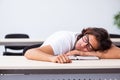 Young male student sitting in the classroom Royalty Free Stock Photo