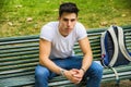 Young Male Student Sitting on Park Bench Seriously Royalty Free Stock Photo