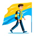 Young male student walking with a large blue and yellow flag behind him. Casual teenager with backpack strolling