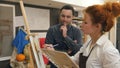 Young male student watching his teacher painting with oil Royalty Free Stock Photo