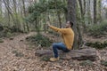 Young male taking a selfie on cell phone in beautiful forest.Outdoor smartphone technology concept lifestyle Royalty Free Stock Photo