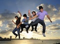 Young male team jumping outdoors Royalty Free Stock Photo