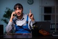 Young male technician repairing computer in workshop at night Royalty Free Stock Photo