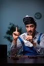 Young male technician repairing computer in workshop at night Royalty Free Stock Photo