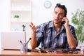 Young male technician repairing mobile phone Royalty Free Stock Photo