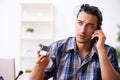 Young male technician repairing mobile phone Royalty Free Stock Photo