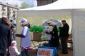 Young male volunteer drawing with little children at table. Volunteering abroad concept - Berezniki on 26 may 2018