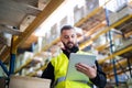 Male warehouse worker with tablet. Royalty Free Stock Photo