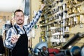 Worker displaying result of his key forming in workplace Royalty Free Stock Photo