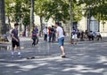 Young males skate at Republic Square