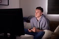 Young Man Addicted To Video Gaming At Home Royalty Free Stock Photo