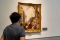 Young man admiring art at a museum | Detail of ancient Roman paintings and art | vintage civilizations | Louvre Abu Dhabi