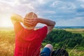 Young man admiring beautiful view of the forest landscape rear view.Young man standing alone summer day outdoors Royalty Free Stock Photo