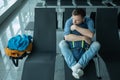 Young man at the airport waiting for his plane looking at the window Royalty Free Stock Photo