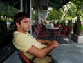 Young Man Alone In The Caffe Royalty Free Stock Photo