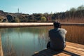 A young man alone on a lake, portrait, la arboleda, basque country Royalty Free Stock Photo