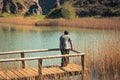 A young man alone on a lake, portrait, la arboleda, basque country Royalty Free Stock Photo