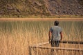 A young man alone on a lake, portrait, la arboleda, basque country Royalty Free Stock Photo