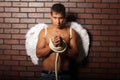 Young man with angel wings.