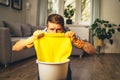 young man angry about doing household and cleaning the floor