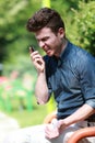 Young man angry on telephone