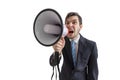 Young man is announcing a message and shouting to megaphone. Isolated on white background Royalty Free Stock Photo