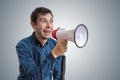 Young man is announcing news with megaphone