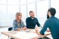 Young man answering questions from interviewers in the office. Royalty Free Stock Photo