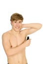 Young man applying deodorant Royalty Free Stock Photo